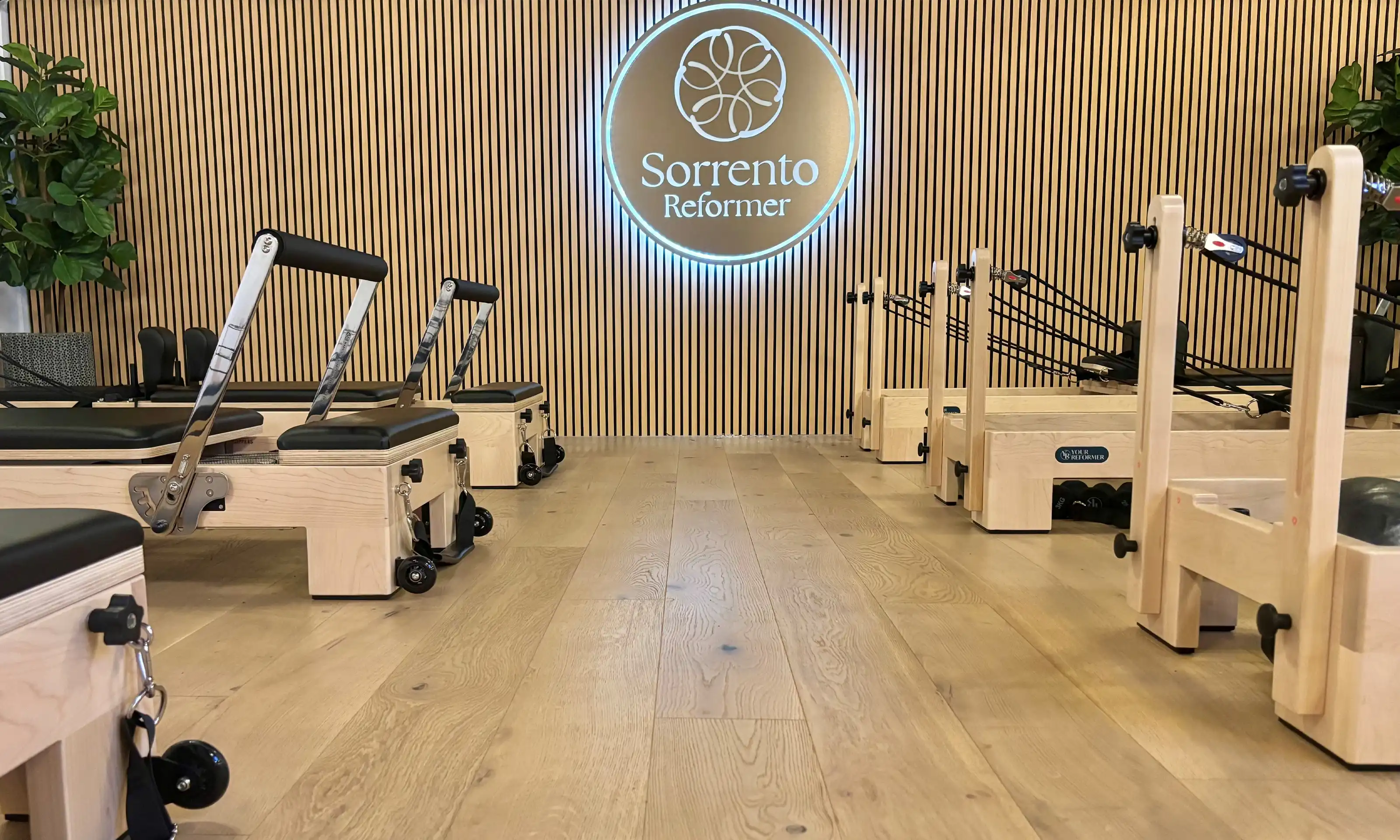Woman practicing Reformer Pilates at Sorrento Reformer studio